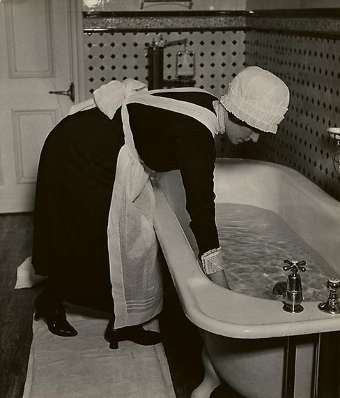 Parlourmaid Preparing a Bath before Dinner, c. 1937© Bill Brandt Archive Ltd.Courtesy Edwynn Houk Gallery