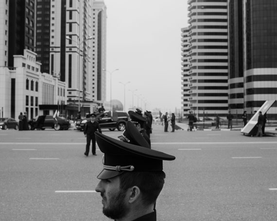 Davide Monteleone: Spasibo, Republic of Chechnya, Russia, 03/2013© Davide Monteleone/VII for Carmignac Gestion Photojournalism Award.Security forces attending the celebration for the 10th anniversary of the Constitution Day. In the background Grozny City, five gleaming towers, the heart of the reconstruction of Grozny and a symbol of the city’s recovery following the destruction wrought at the beginning of the millennium. Grozny, March 23rd 2013.