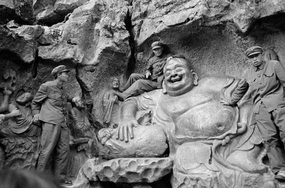 Soldiers on Yuan Dynasty sculpture of a Maitreya, West Lake near Hangzhou by Inge Morath. China , 1978. Silver gelatin print, 48 × 31.9 cm. © Inge Morath / Magnum Photo, courtesy of the °CLAIR Gallery