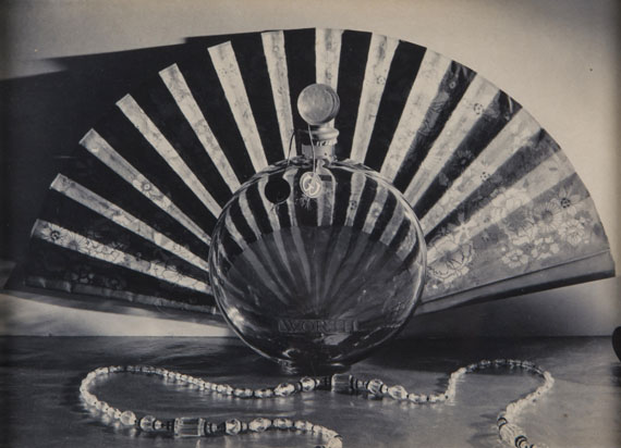 Lot 10  Paul Outerbridge, Necklace, Fan and Perfume, ca.1925 (£2,000 - 3,000)