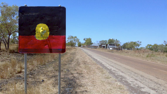 Brenda L Croft: NT Intervention sign, customised by John Leeman, Daguragu, 29 August 2011, from Sign of the times. Pigment print, 70 x 84cm