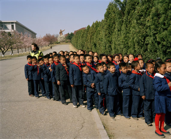 NORTH KOREA. Pyongyang. Schoolchildren on their way back from Mansu Hill. 1997 © Martin Parr / Magnum Photos.
