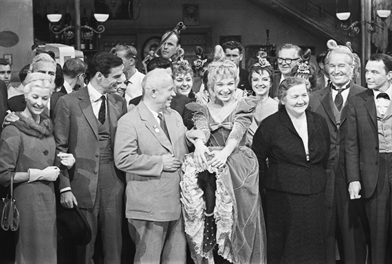 Alexander UstinovNikita Khrushchev’s visit to the USA. In the foreground from right to left: Frank Sinatra, Maurice Chevalier, Nina Khrushcheva, Shirley MacLaine, Nikita Khrushchev, Louis Jourdan.19–20 September 1959