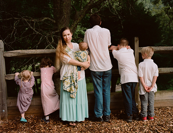 GLENNA GORDON, White Motherhood 2017On her website, Ayla Stewart, "A Wife with a Purpose," promotes #tradlife—traditionalist homemaking and white culture—and the “white baby challenge,” in which she encourages “white people to have children to combat demographic decline.” She poses here for a portrait at a public park in the southeastern USA with her six children on August 16, 2017. She insists that she isn’t racist and has black friends. To her, racism has only one singular definition, and anyone who calls her a racist is just wrong or hasn’t taken the time to learn about her views. Nazism, however, has three definitions, which she can delineate with ease.