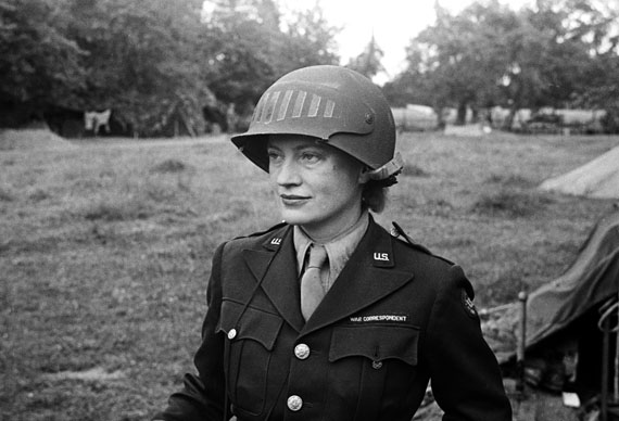 Lee Miller wearing a special helmet borrowed from U.S Army photographer Don Sykes (Sergeant), Normandy France, 1944© Lee Miller Archives, England 2020All rights reserved. leemiller.co.uk