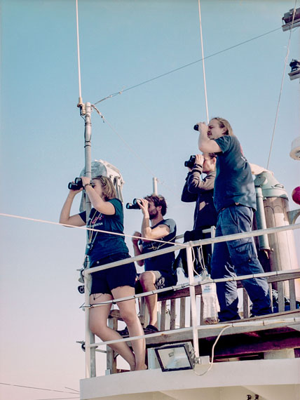 Annette HauschildCrew monitoring the sea, Mission Lifeline, civilian rescue ship on the Mediterranean, 2017, from the series The Helpers, 2016–2018© Annette Hauschild/OSTKREUZ