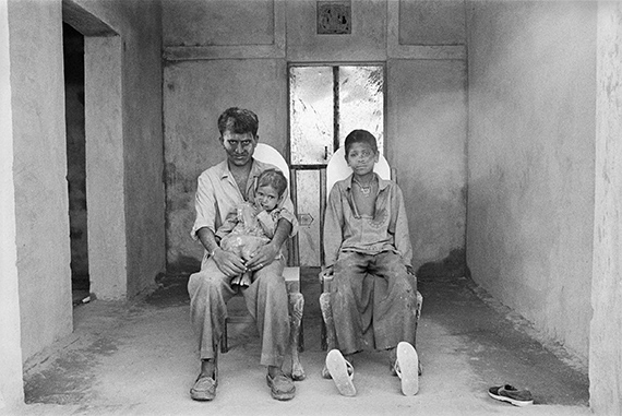 Hanuman Nath with His Daughter and Hem Nath, on Holi Day, Lunkaransar, 1999-ongoing © Gauri Gill
