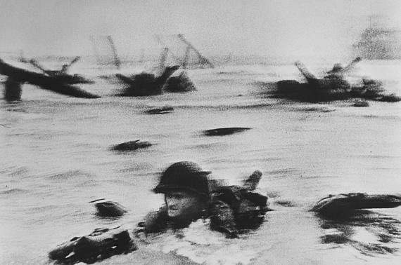 Robert CapaUS troops assault Omaha Beach during the D-Day landings,Normandy, France, June 6th, 1944© Robert Capa © International Center of Photography / Magnum Photos 