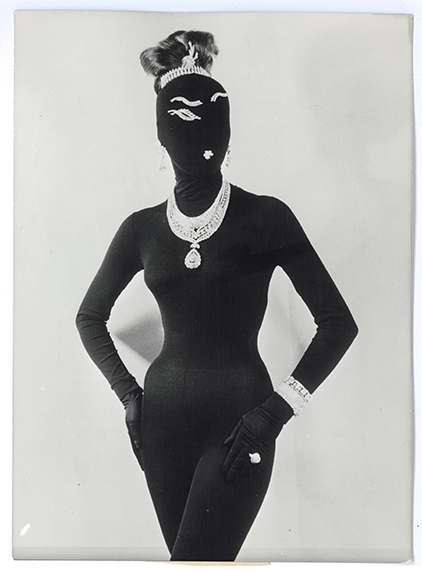 KeystoneDémonique, divertissiment en diamants“Surrealist presentation by the Paris Fashion Group.Model Taïga, wearing Repetto tights and a black hood, presents 500 million oldfrancs worth of Van Cleef & Arpels diamonds. Hairstyle created by Alexandre”.Vintage silver salt printFrance, January 26, 196113 x 18 cm