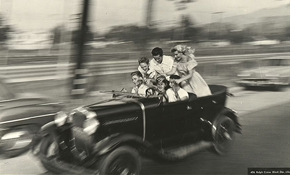 Ralph Crane, Teenage boys & girls in a hot rod car, careening recklessly at 70m.p.h. as driver has his hands off the wheel while back-seaters are standing up, Los Angeles, California, USA, 1949, &copy; Black Star, Life
