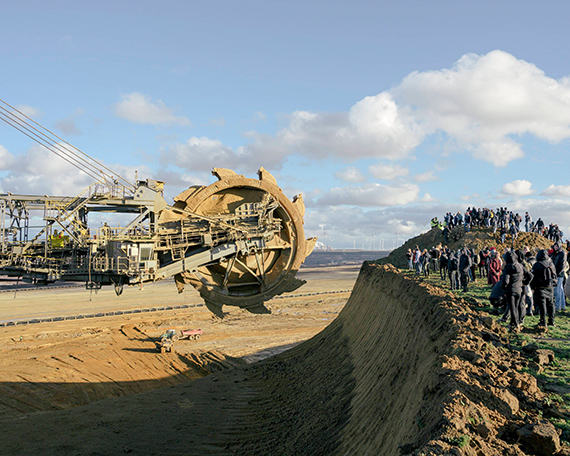 People are blocking the bucket-wheel excavator on the edge of the Garzweiler II open-pit
mine near the outskirts of Lützerath, Germany, on January 8, 2023. When individuals are
present in the danger zone at the edge of the mine, the bucket-wheel excavator must pause
its operation until the affected area is vacated by those individuals.
© Ingmar Björn Nolting People are blocking the bucket-wheel excavator on the edge of the Garzweiler II open-pit
mine near the outskirts of Lützerath, Germany, on January 8, 2023. When individuals are
present in the danger zone at the edge of the mine, the bucket-wheel excavator must pause
its operation until the affected area is vacated by those individuals.
© Ingmar Björn Nolting