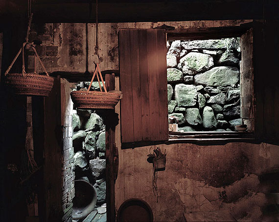 ROBERT VAN DER HILST: “Chinese Interiors #100: Rock Wall, Baskets in Wooden Kitchen. Shen'ao Village, Zhejiang Province" (2006) Archival pigment print. 46cm x 56cm - Ed. of 15; 67cm x 80cm - Ed. of 10; 110cm x 131cm - Ed. of 5. © Robert van der Hilst. Courtesy of m97 Gallery.
