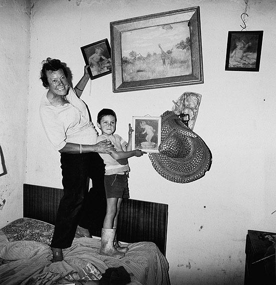 Roger Ballen, Diamond digger and son standing on bed, Western Transvaal, 1987Silver Gelatin Prints, 54cm x 51cmCourtesy the artist and Gagosian Gallery