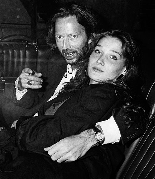 October 24, 1989: New York – Eric Clapton and Carla Bruni arrive at Red Zone for Bill Wyman's birthday party. CREDIT: Ron Galella