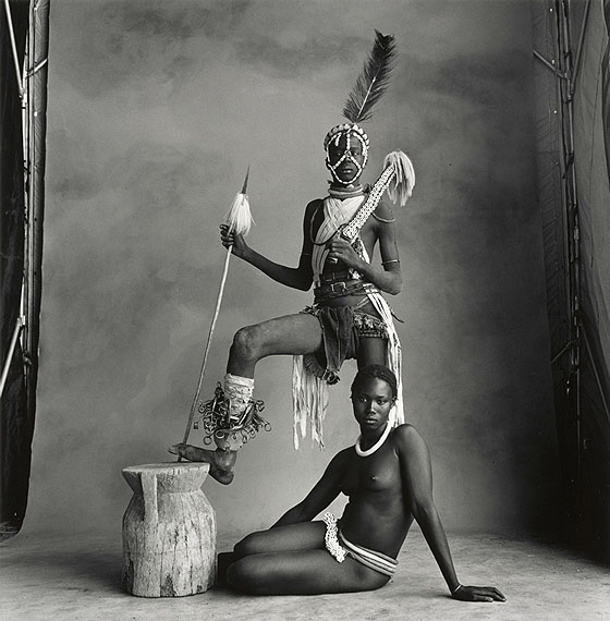 IRVING PENNStanding Warrior, Sitting Girl, Cameroon, 1969Gelatin silver print toned in selenium mounted to boardc. 45 x 43 cm  Edition of 5© The Irving Penn Foundation