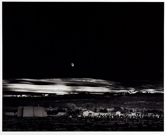 LOT 1075Ansel Adams (1902–1984) ›Moonrise, Hernandez, New Mexico‹Gelatin silver print, printed 1970s, mounted on original cardboard39,3 x 49 cm (15,5 x 19,3 in)1941