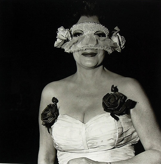 Lady at a Masked Ball with Two Roses on Her Dress NYC 1967 © Diane Arbus