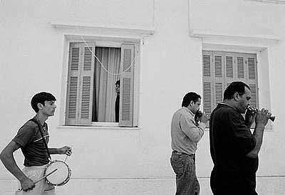 Nikos Economopoulos: Mesologi, Gipsy musicians in the feast of St. Simeon, Greece, 2003. 62.6x82.6cm. © Magnum Photos