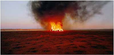 ROSEMARY LAING: One Dozen Unnatural Disasters in the Australian Landscape, Burning Ayer #6, 2003C-print, mounted and framed, 110 x 224 cm, Ed. 8 (courtesy:Galerie Conrads, Düsseldorf)