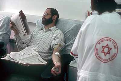 Jean MohrGiving blood at the Magen David Adom centre in Jerusalem 2002 