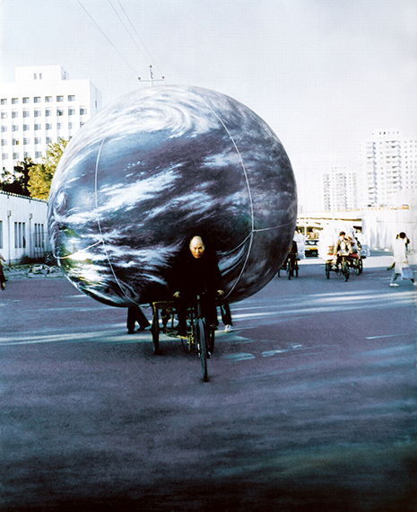 Seung-taek Lee, Earth Touring Beijing, 1994. 
Performance documentation, paint on C-print. Image courtesy of the artist and Gallery Hyundai.
