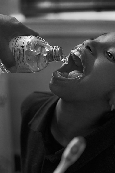 LaToya Ruby Frazier, 
Shea Brushing Zion’s Teeth with Bottled Water in Her Bathroom, Flint, Michigan, 
Flint is Family in Three Acts, 2016-2017 
© 2023 LaToya Ruby Frazier, courtesy of the artist and Gladstone gallery.
