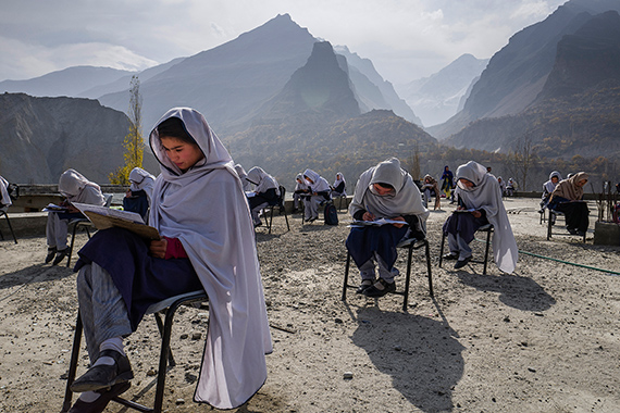 Schoolgirls take an exam on the roof of their school in the Hunza valley. This region has the highest literacy rate in Pakistan.© Sarah Caron/Edition Lammerhuber