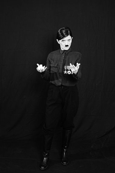 Elena Bellantoni,  Reenactment the Banality of Evil in 69 gestures,  69, foto in bianco e nero,  40x50 cm, 2022, Courtesy Elena Bellantoni, 25
