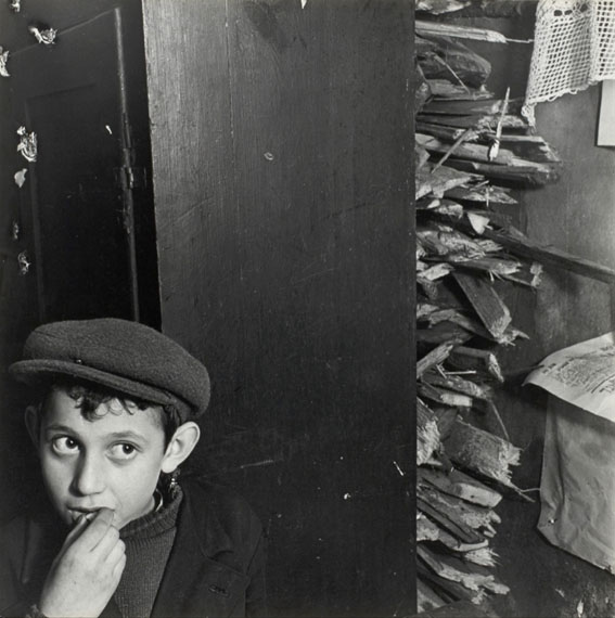 Roman Vishniac: Boy with kindling in a basement dwelling, Krochmalna Street, Warsaw, ca. 1935-38© Mara Vishniac Kohn, courtesy International Center of Photography 